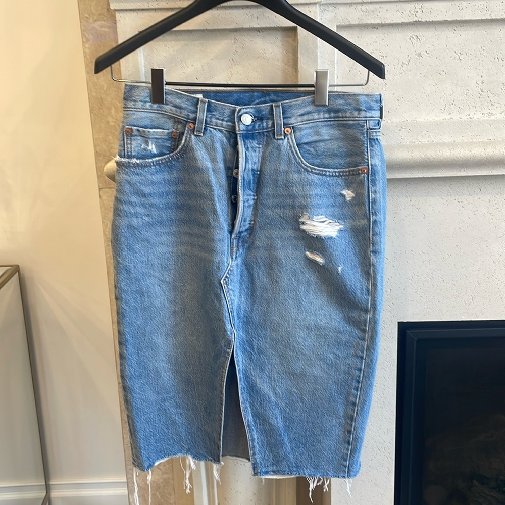 Levi’s distressed midi button down fly jean skirt. Size 29. Never worn.